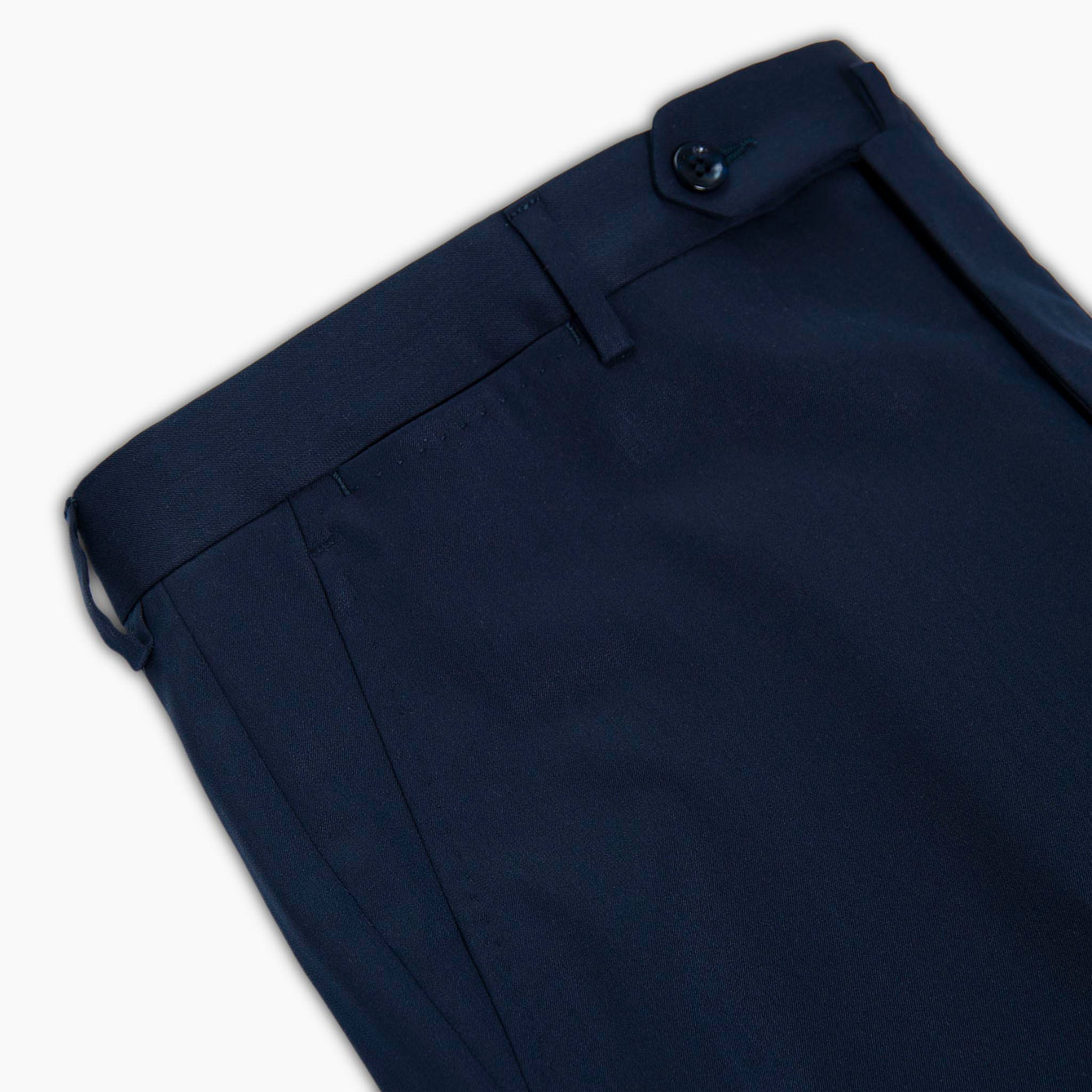 Close up of dark blue fine twill of 290 g yarn-dyed elasticised wool polyester chino style pants for man